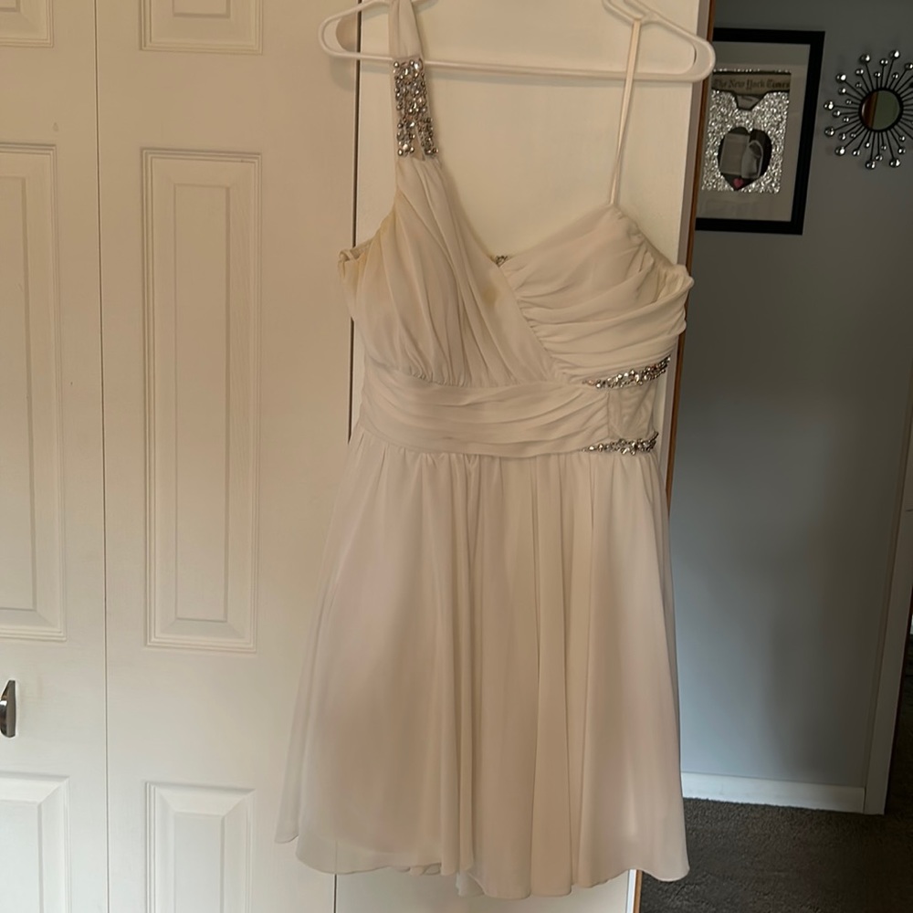 Or this once for my engagement party never been worn again size 17